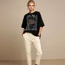 a-white-aesthetic-woman-wearing-black-oversized-ts.webp
