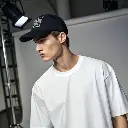 male-model-wearing-a-plain-black-sports-cap--paire (1).webp